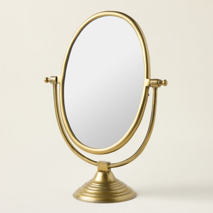 Vintage-inspired standing mirror with a durable frame and a unique antique brass finish.