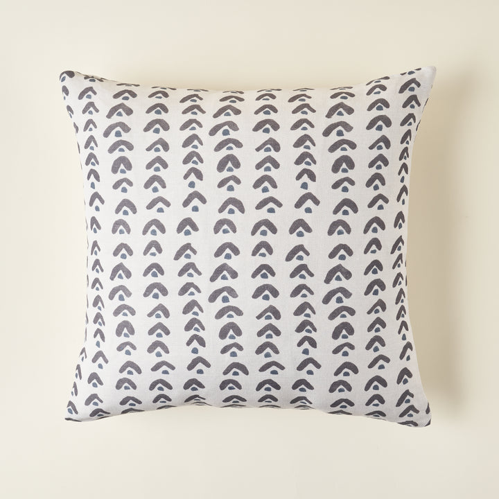 A square Leo pillow cover with a natural, repeating pattern on a textured linen-cotton fabric. The colors are soft and muted.