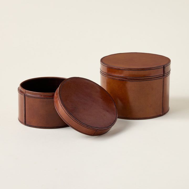 A stitched leather box with a soft interior, perfect for storage.