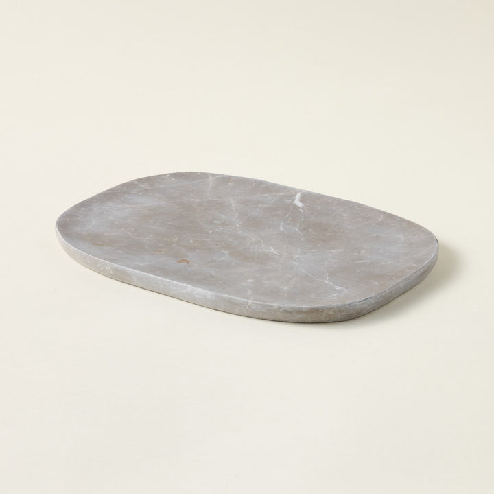 A beautiful beige marble tray crafted from Italian marble.