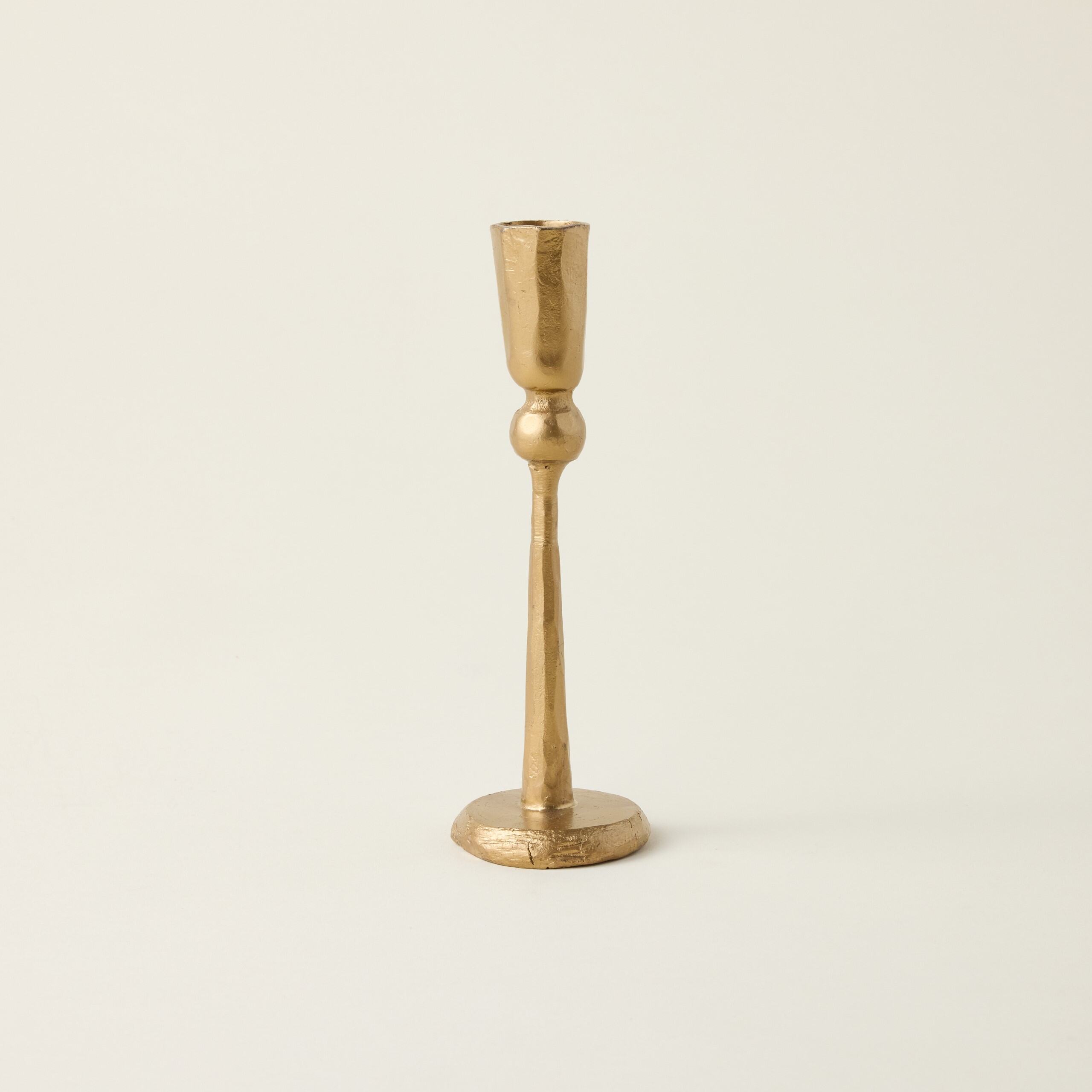 Hand-forged metal taper candle holder.