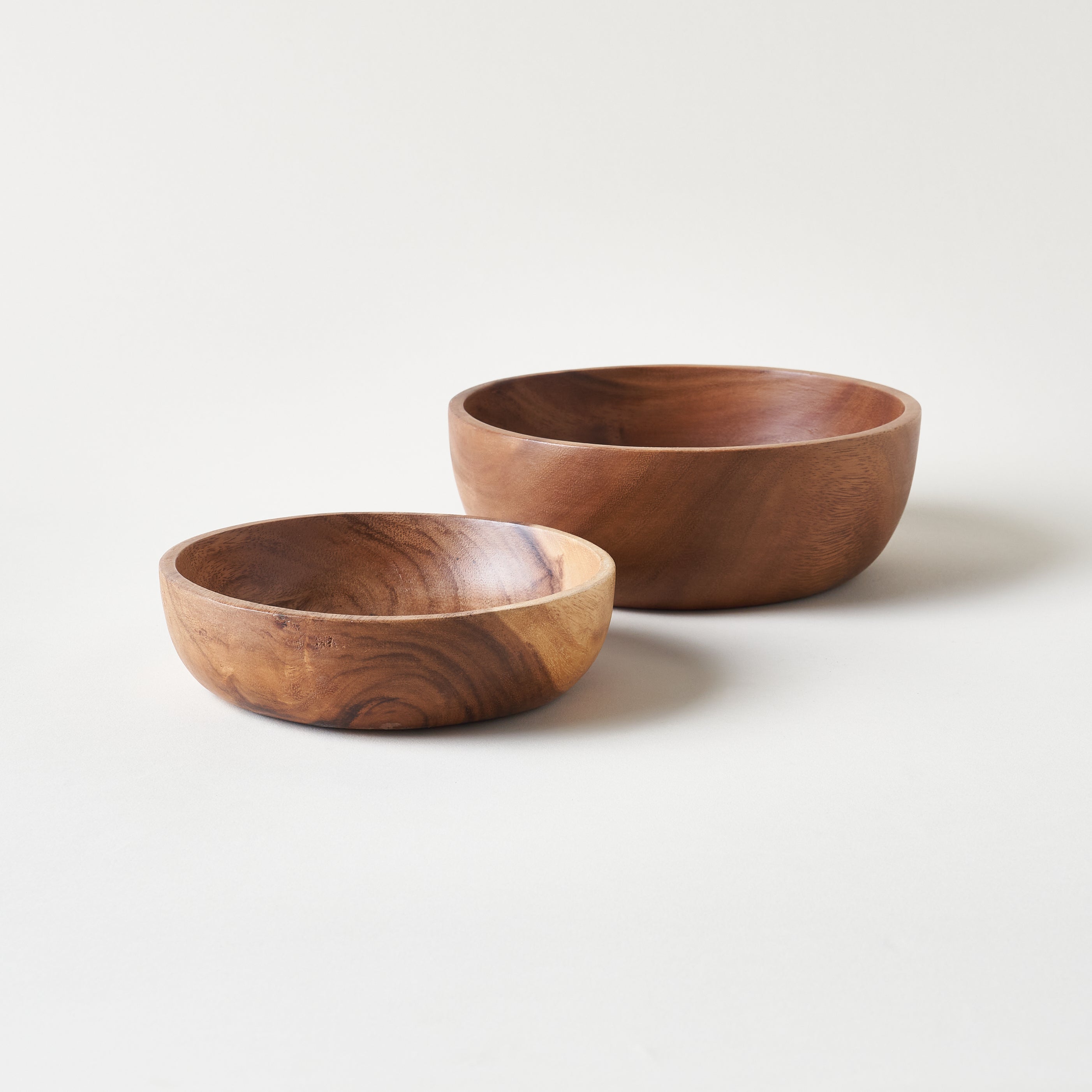 A set of two bowls made from acacia wood.