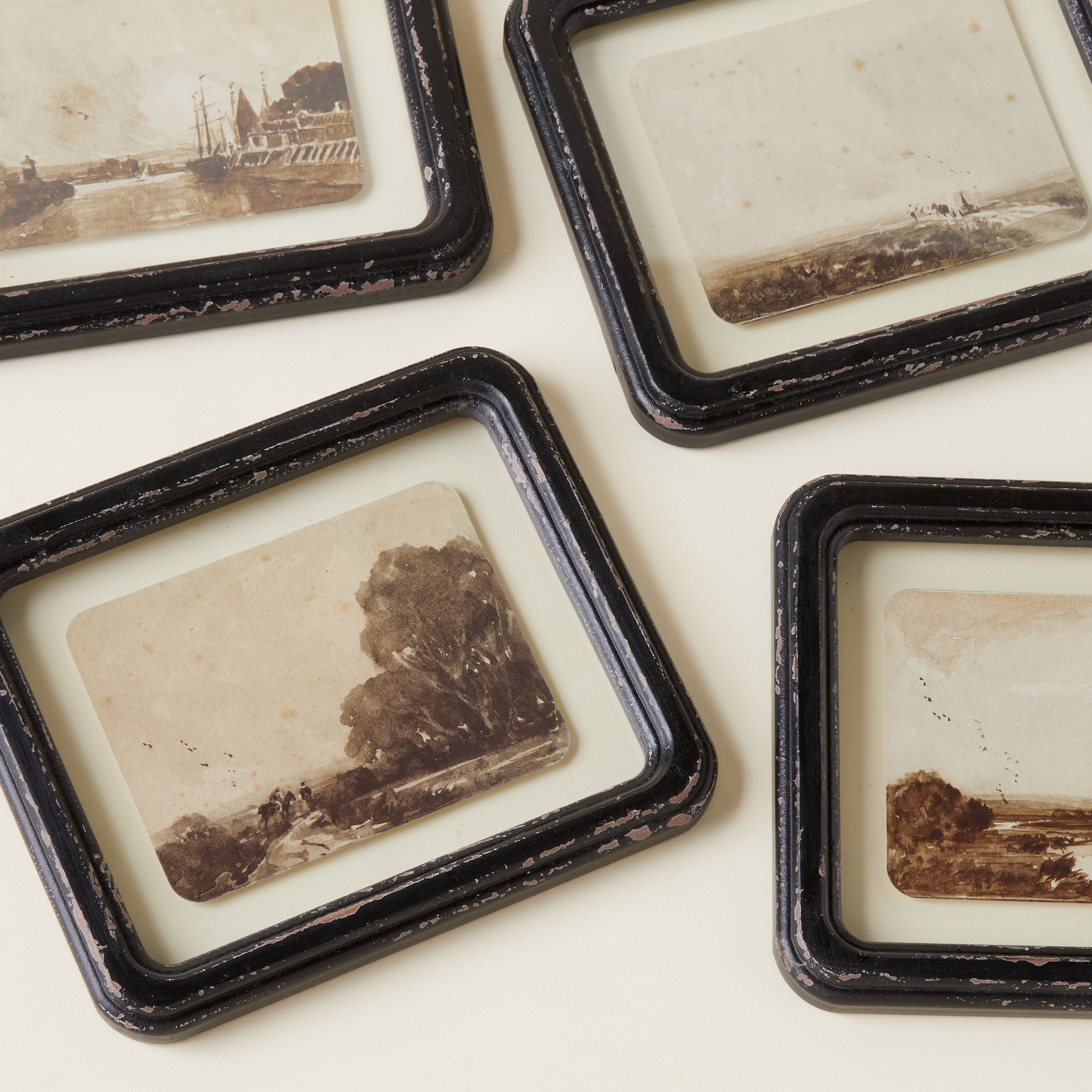 Vintage-inspired antique landscape art print in a wooden frame with a weathered appearance.