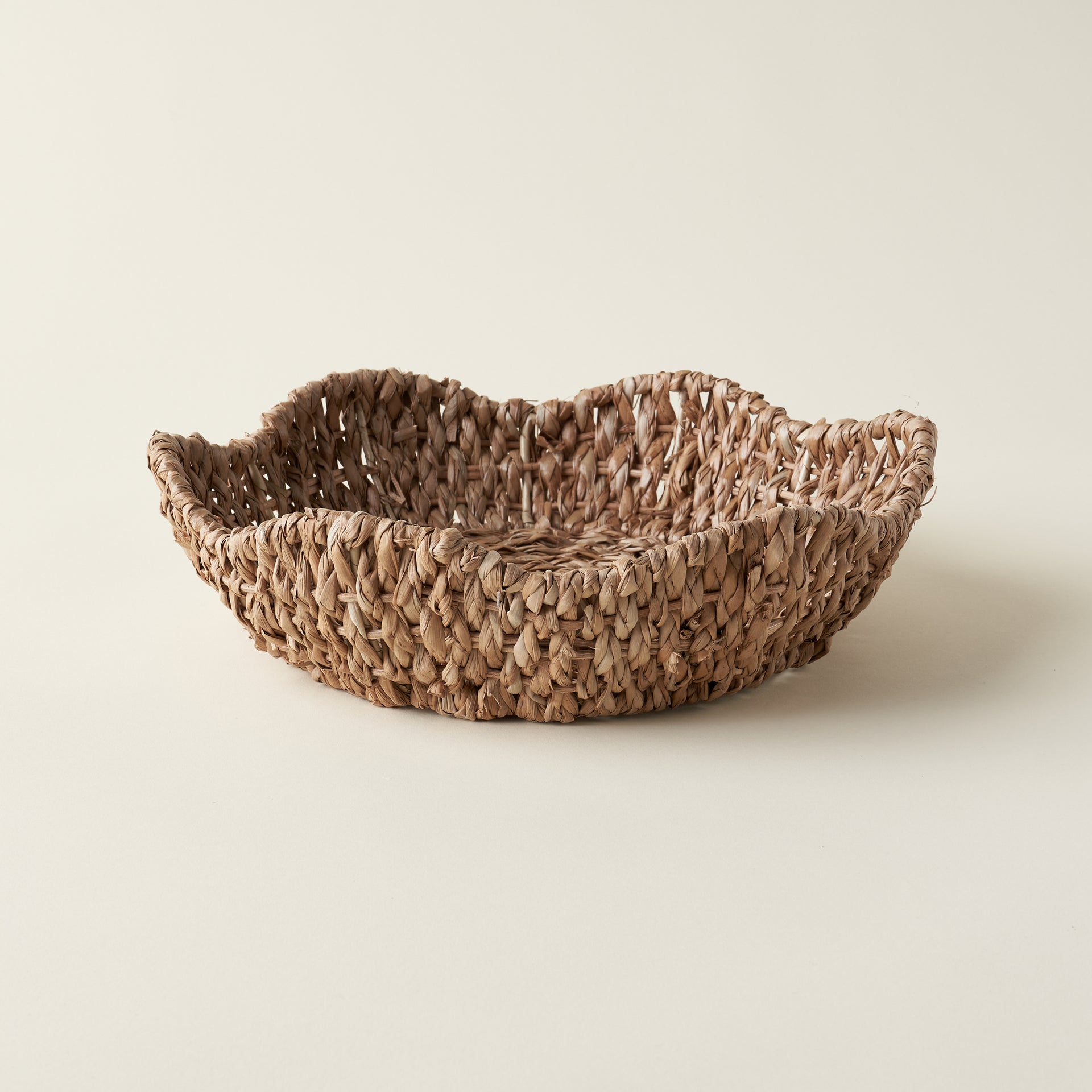 Braided bankuan bowl with scalloped edges.