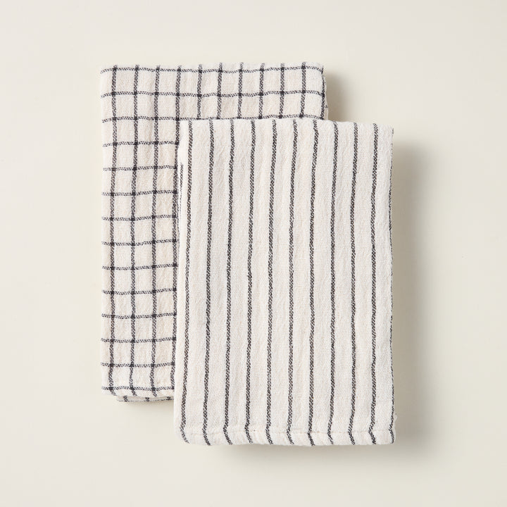 Set of two cotton tea towels with stripe and check patterns.