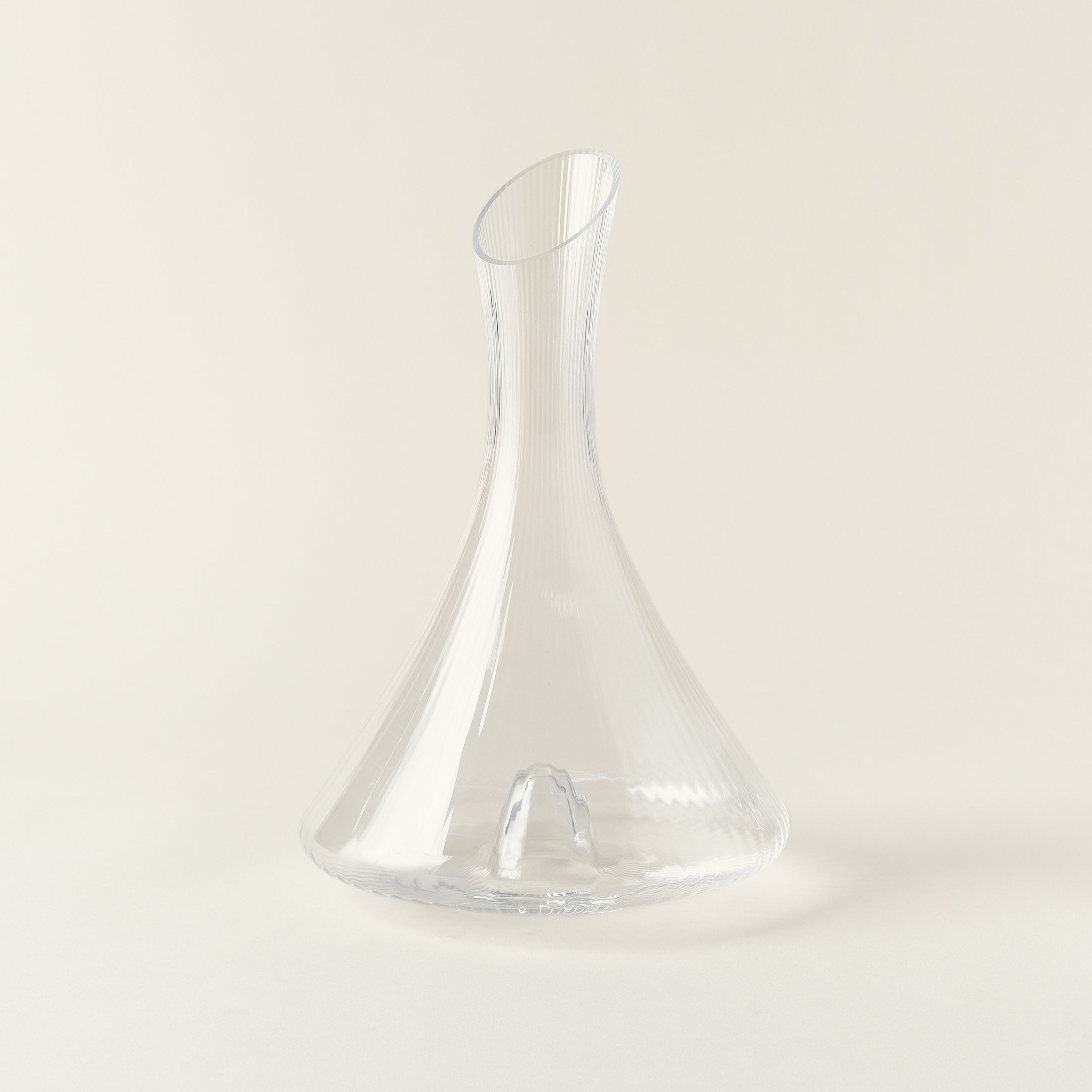 Clear glass decanter with a linear, textured design.