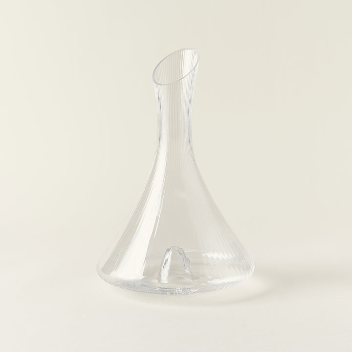 Clear glass decanter with a linear, textured design.