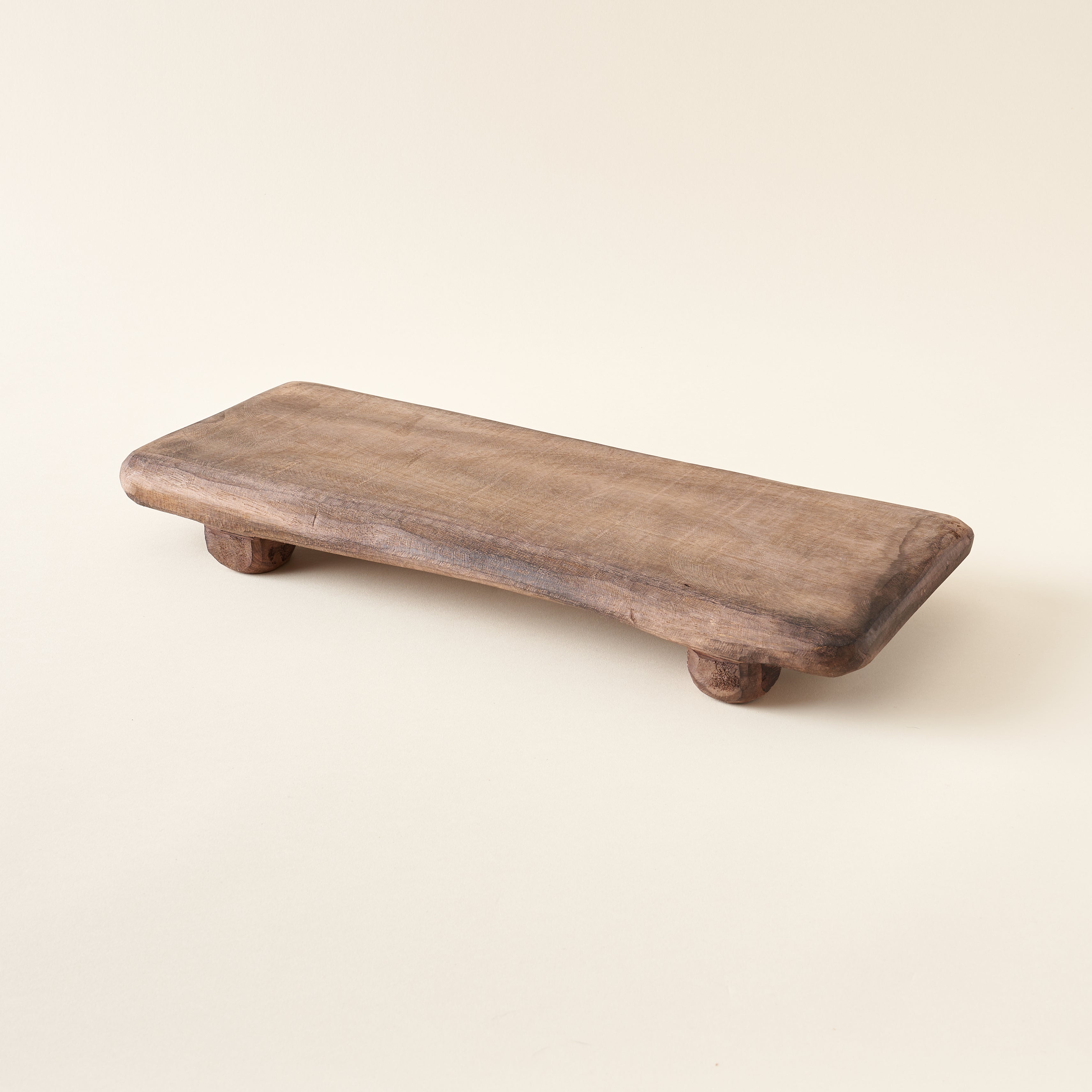 Decorative wood board with a rustic design.