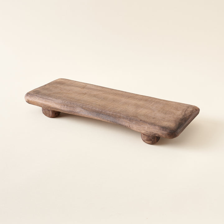 Decorative wood board with a rustic design.