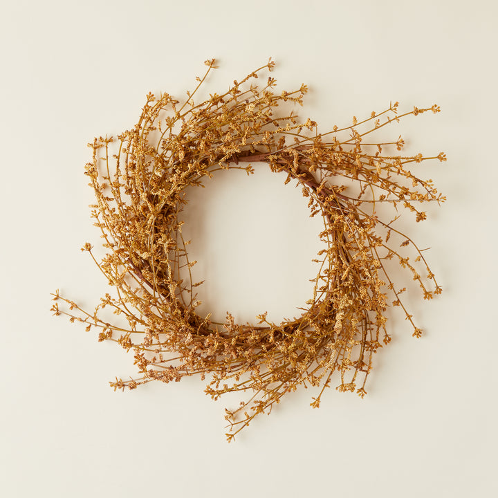 Faux wildflower wreath with lifelike tan wildflowers.