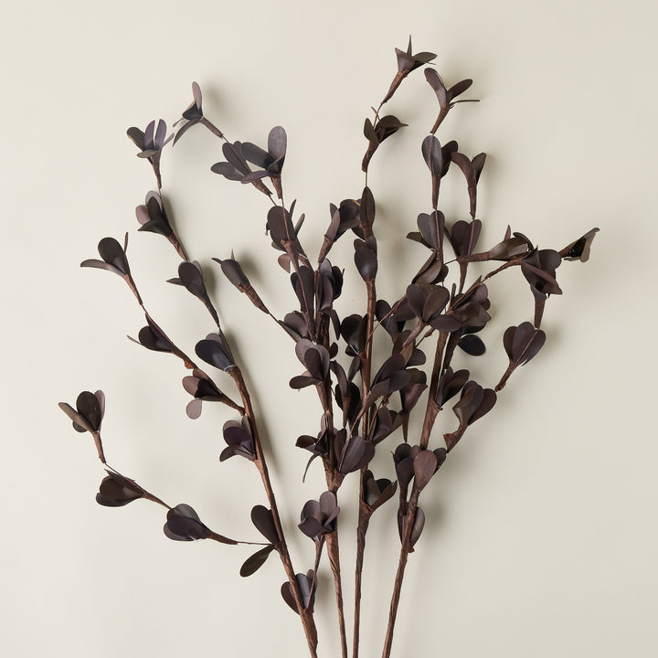 Single faux dried brown botanical stem for a vase, to be used in a home decor arrangement.