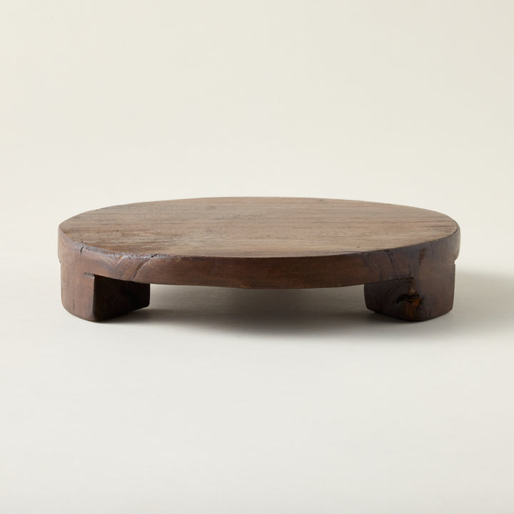 Found wood pedestal with a rustic, vintage-inspired look and a visible grain.