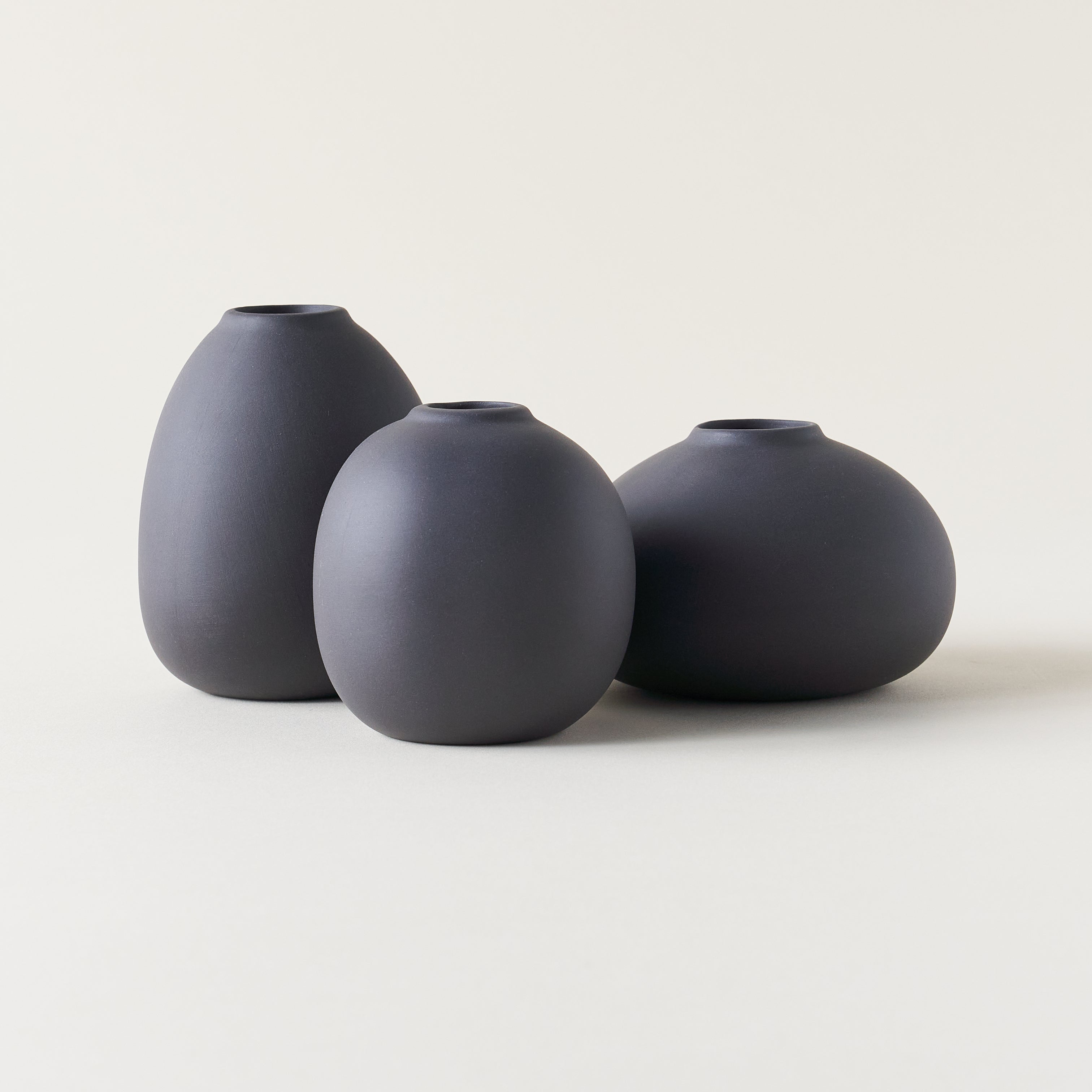 Set of three Frisco clay vases in different sizes.