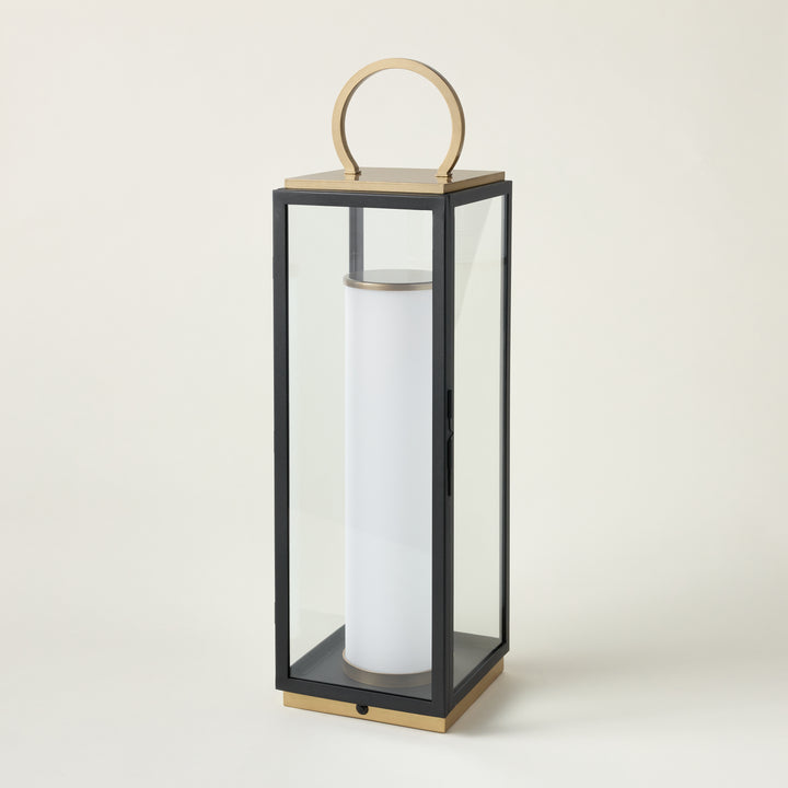 A portable, rechargeable outdoor lamp with a Textured Black and Patina Brass finish.