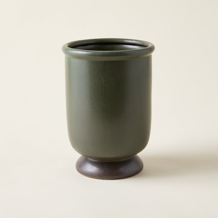 Handcrafted Sydney vase with an organic round shape and a unique, earthy green reactive glaze.