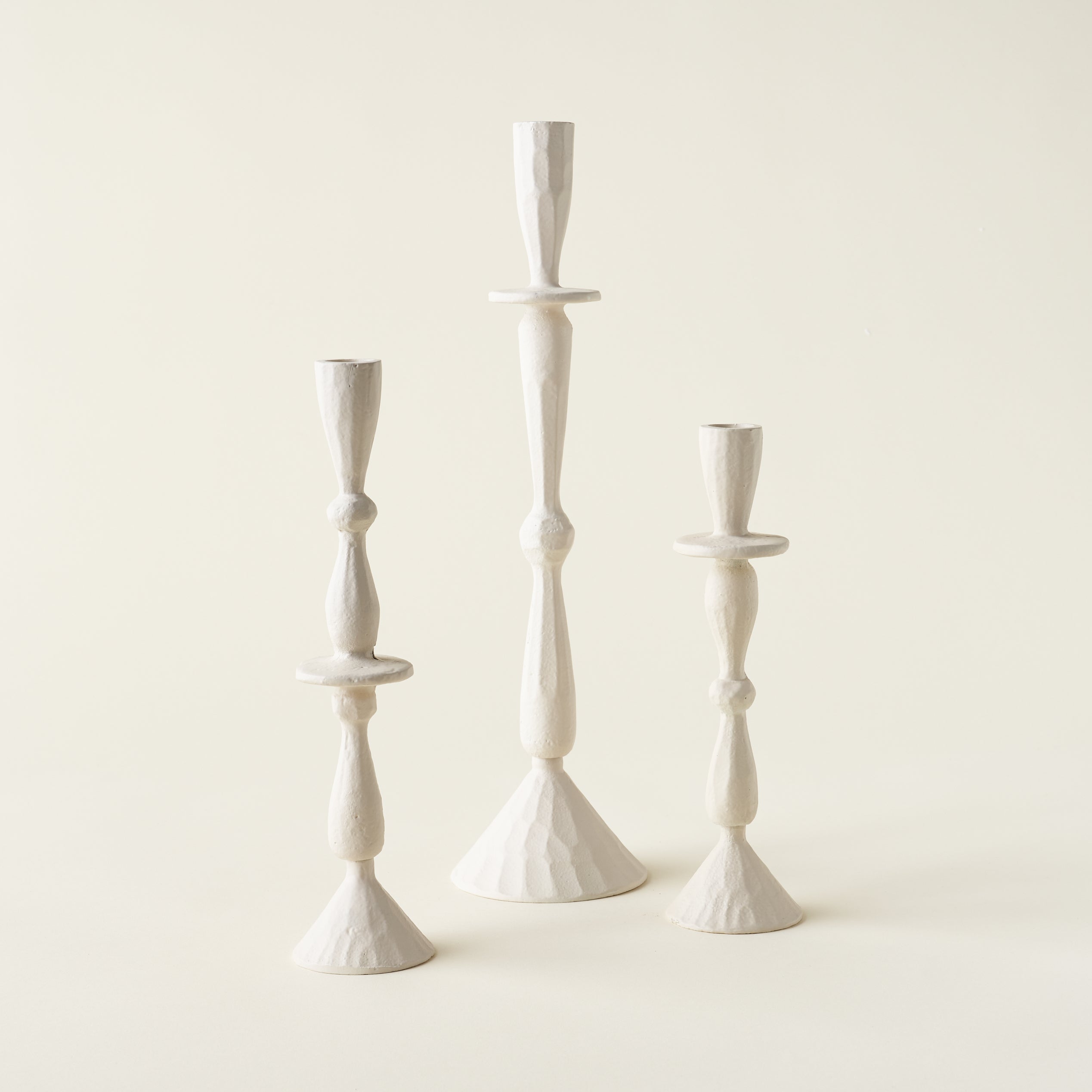 Set of three sleek candle holders in varying heights.