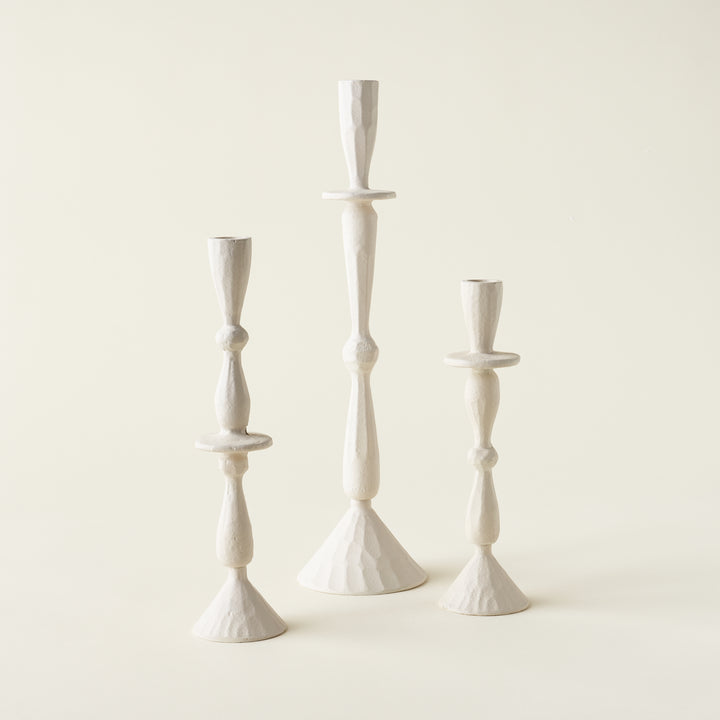 Set of three sleek candle holders in varying heights.