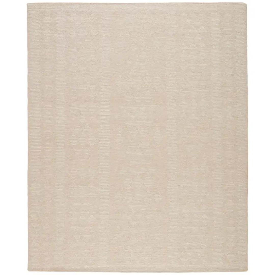 A hand-knotted rug with a tribal motif in pink and cream colors.
