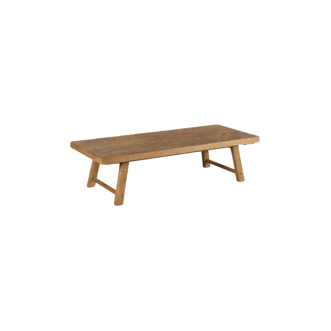 Finley coffee table with a rustic rectangular top and angled legs.