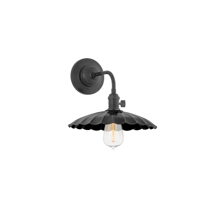 Heirloom Sconce with a delicate petal shade and an Old Bronze finish.