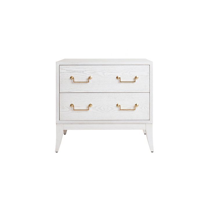 A Sabre Leg side table with two drawers, a white-washed oak finish, and a brass swing handle.