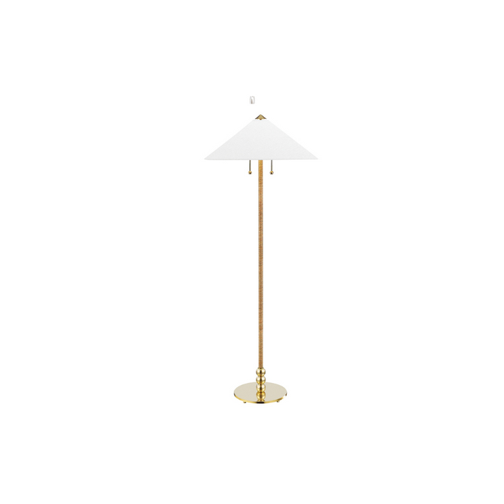 A floor lamp with a shade made from rattan and an aged brass base.