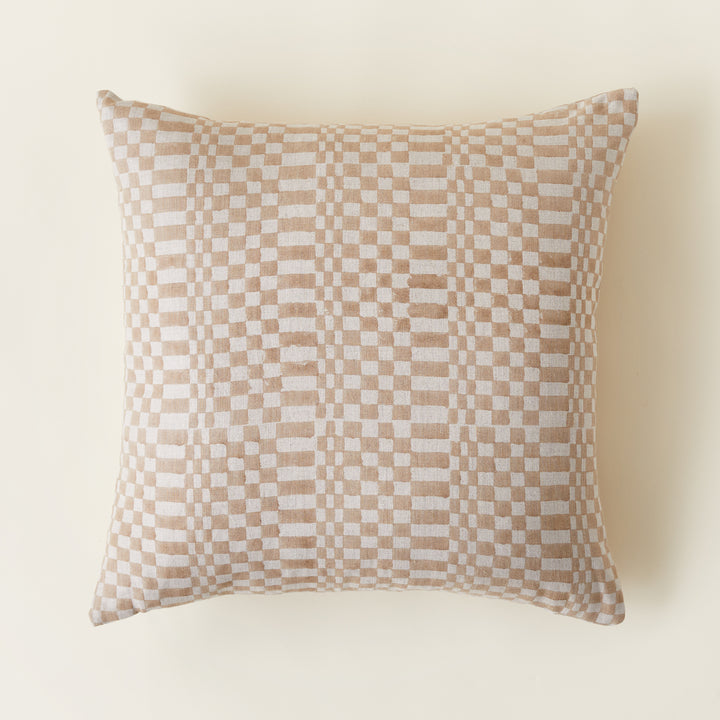 A decorative pillow cover featuring a unique, imperfect checkered pattern, shown flat to display the full design and texture.