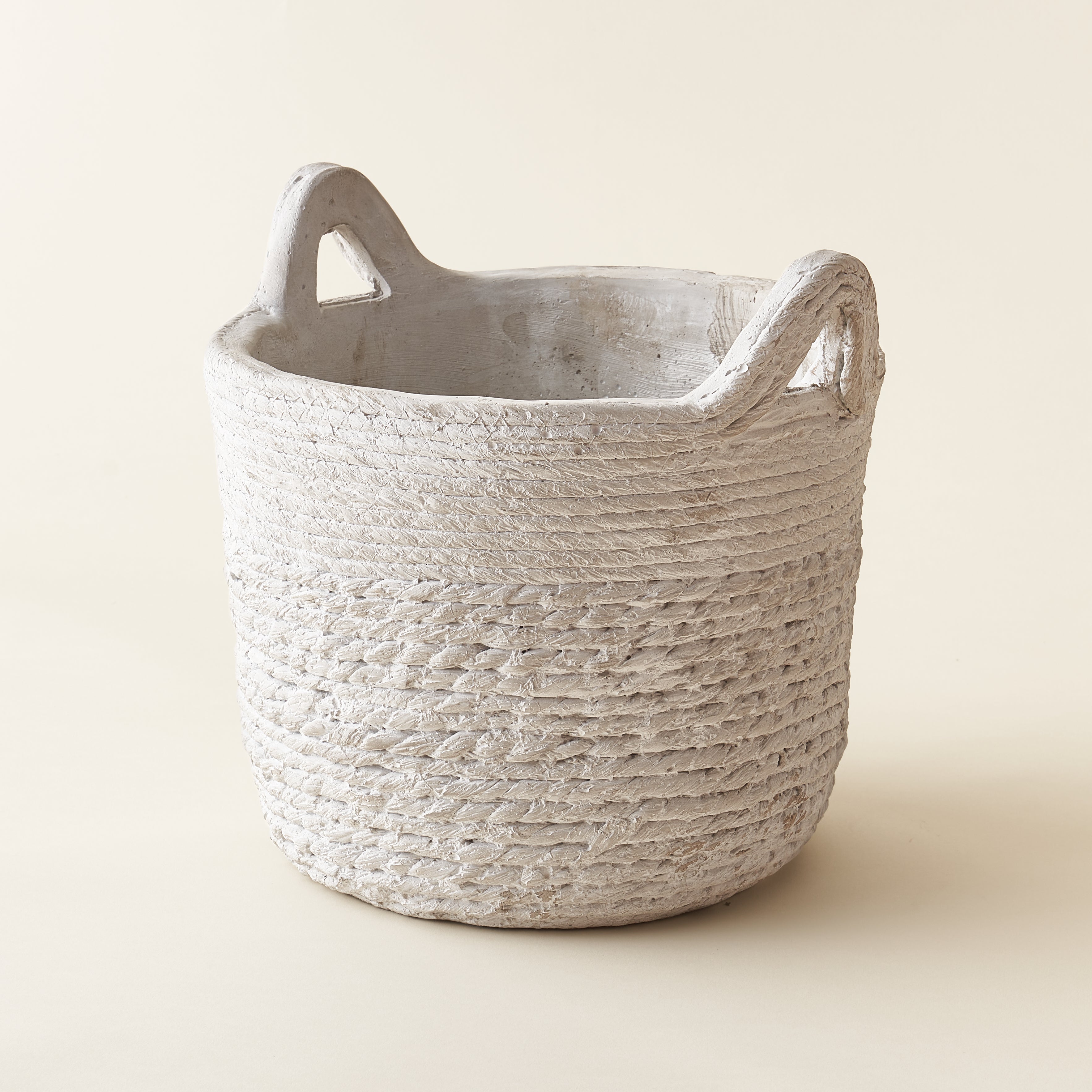 Landon basket-style planter crafted from cement.