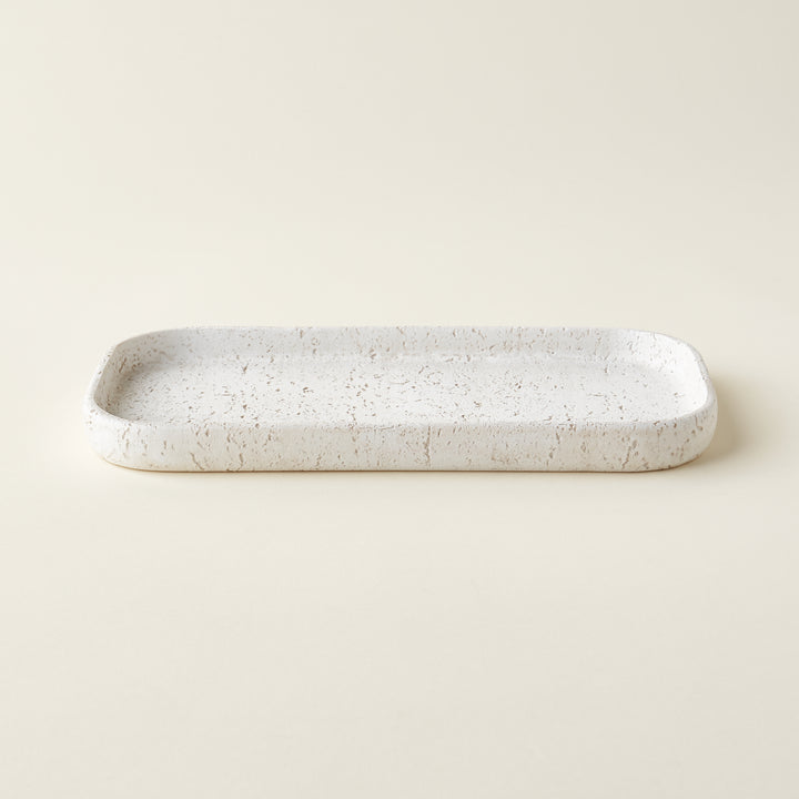 A rectangular tray made of durable resin with a gray limestone-like texture.