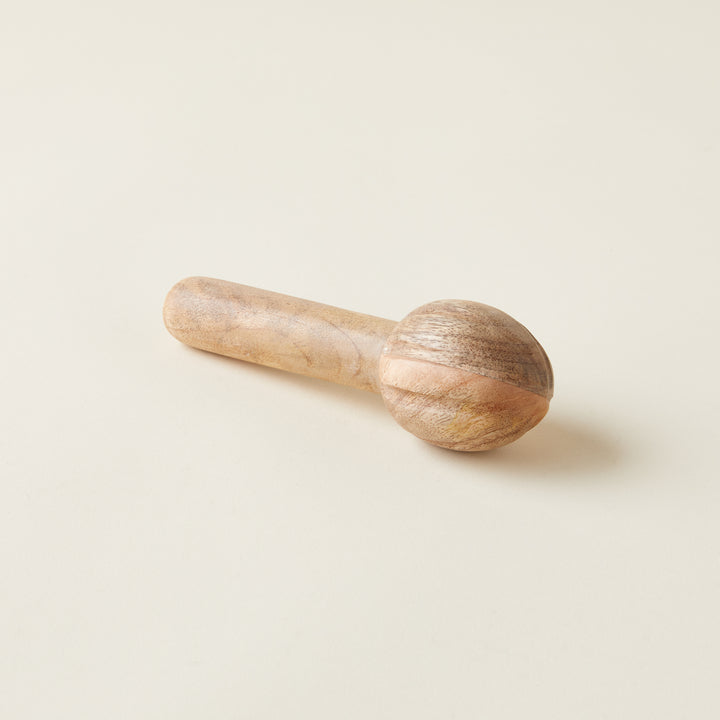 Mango wood citrus reamer, a natural and ergonomic juicing tool.