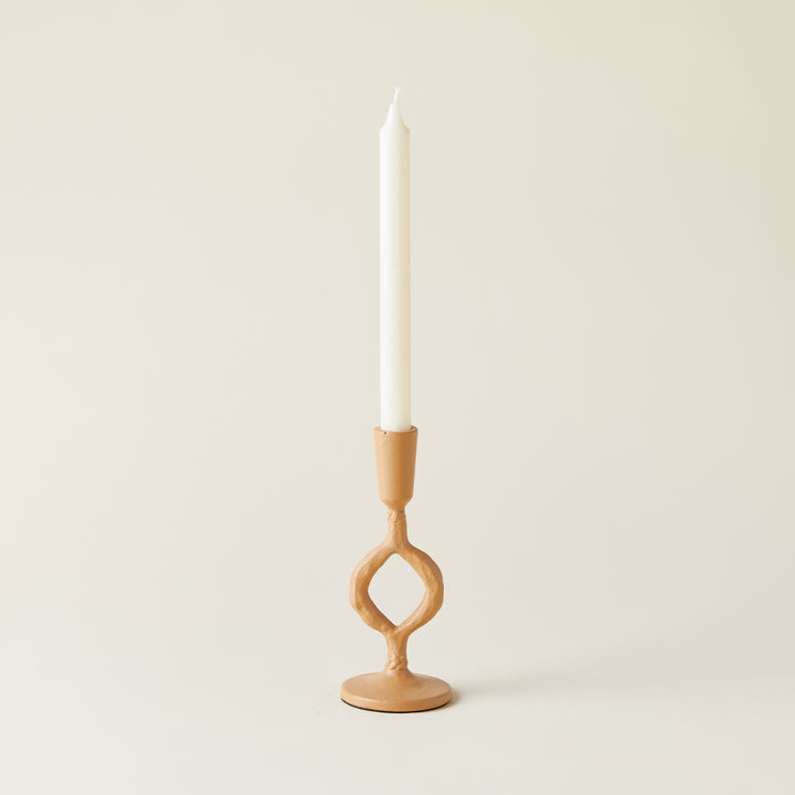 Matte taper holder with a circular design in a tan finish.
