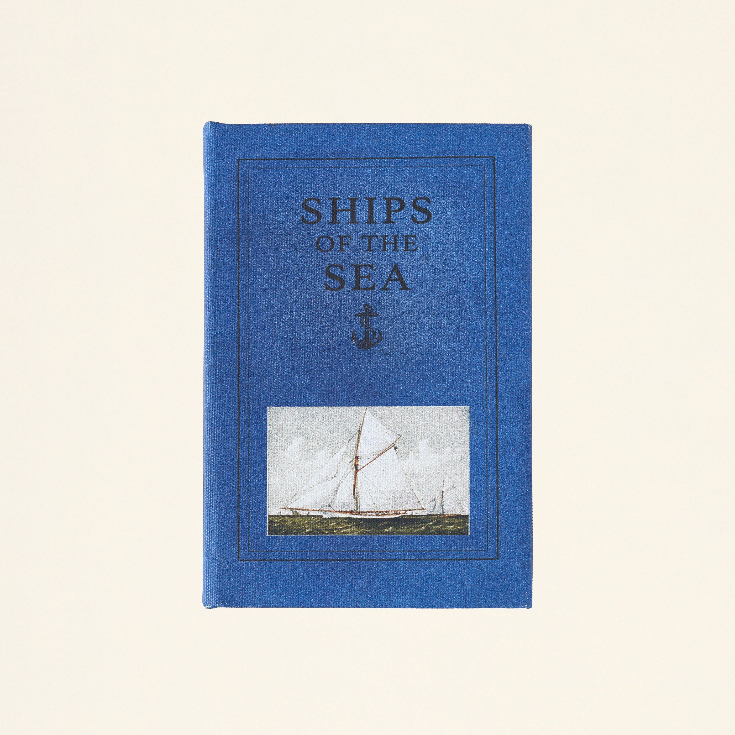 Mini storage box designed to look like a book.