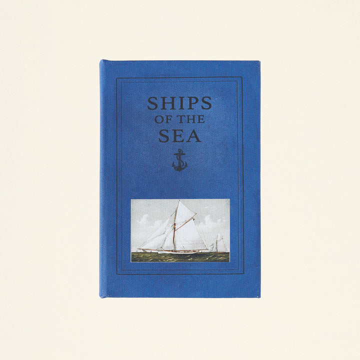 Mini storage box designed to look like a book.