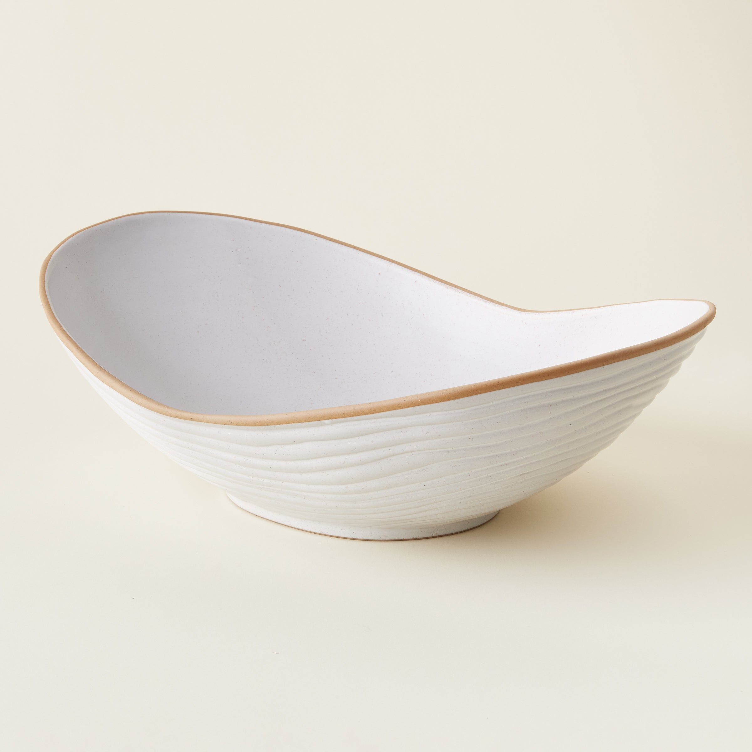 Monte Bowl, matte white with speckled clay and brown bisque edges.