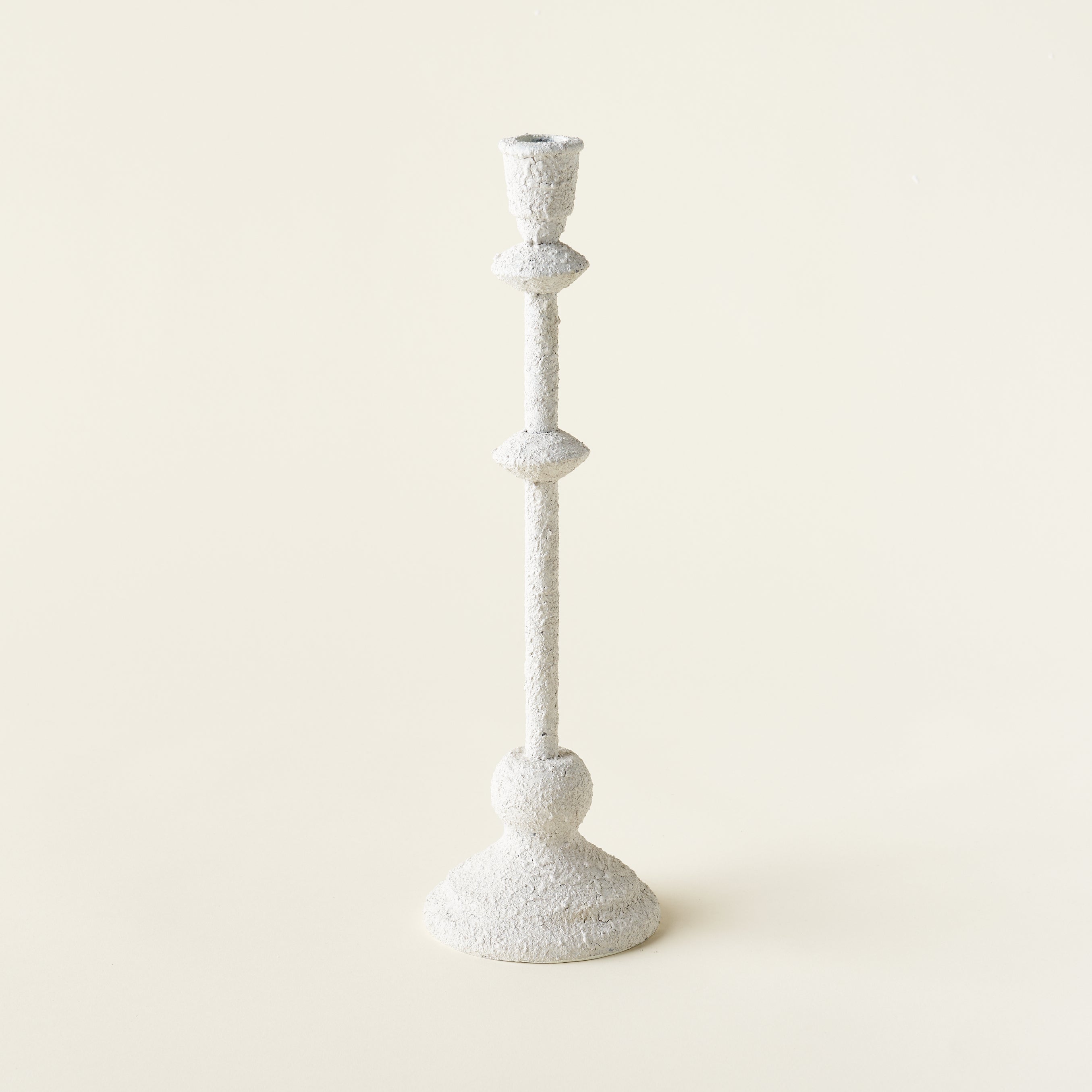 Petite white metal taper holder with a sand finish.