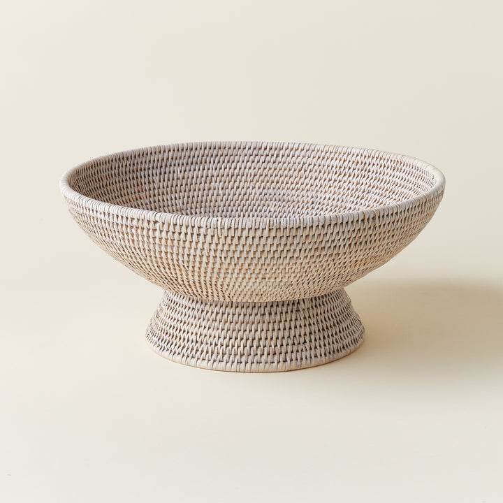 A hand-crafted Burmese rattan offering bowl with a tight weave and natural finish.