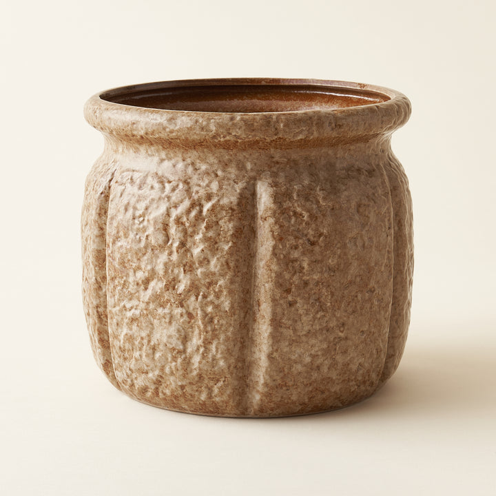 Sawyer planter, a 7-inch stoneware pot holder with a unique, textured finish.