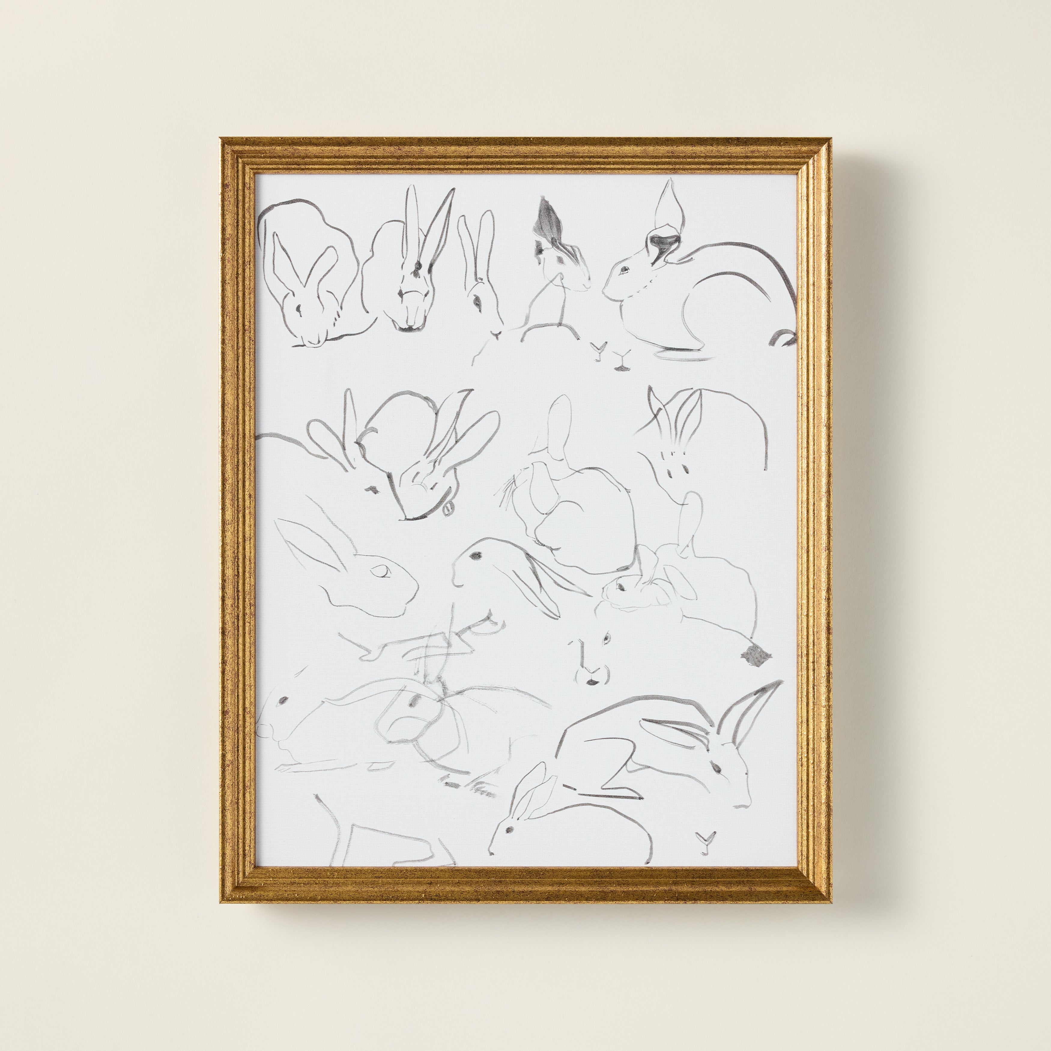 Vintage-inspired art print of sketched bunnies on a stretched canvas, featuring a distressed and aged patina.