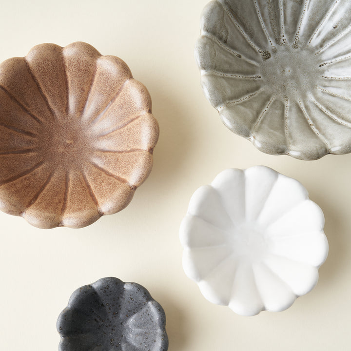 Stoneware flower dish with a unique reactive glaze.