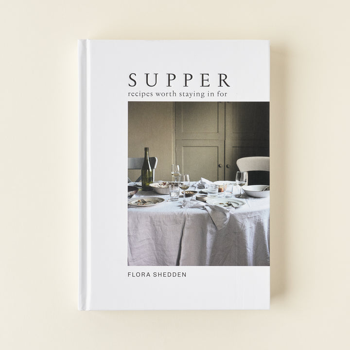 "Supper: Recipes Worth Staying in For" book, a curated guide to joyful home cooking.