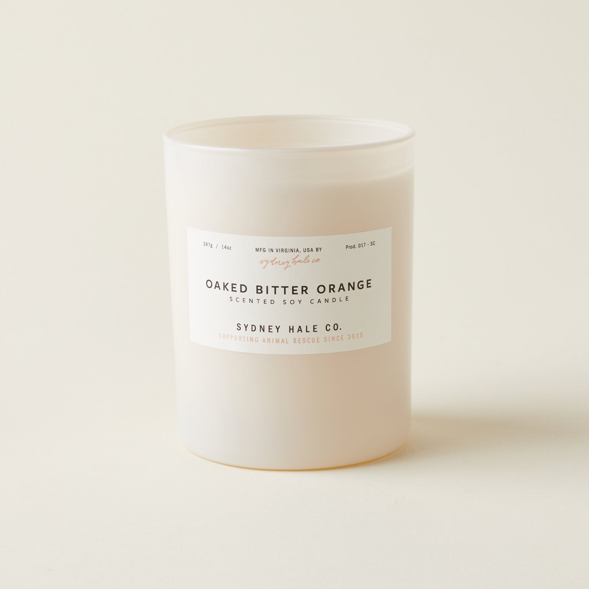 Sydney Hale scented candle with an oaked bitter orange and patchouli fragrance in a glass vessel.