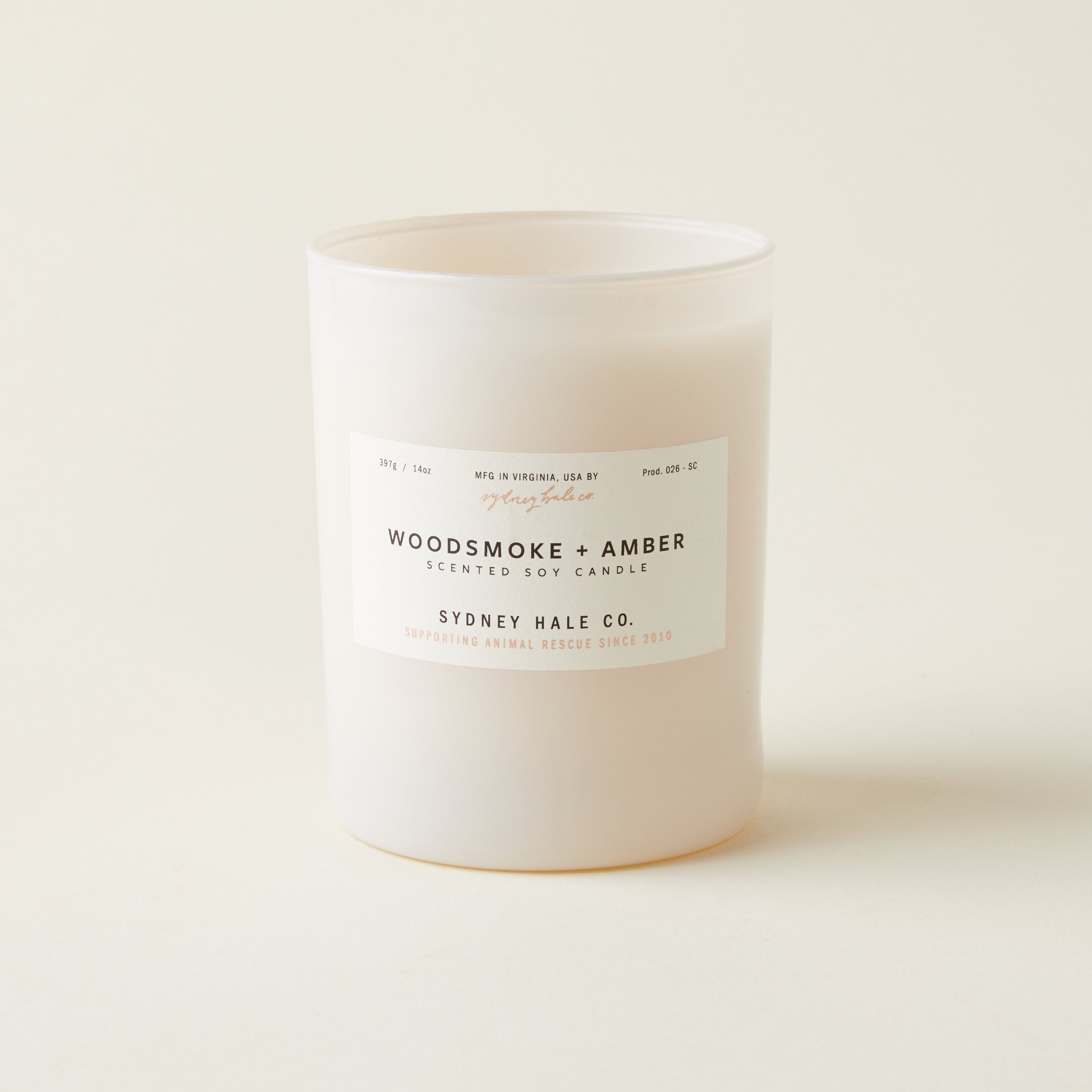 Sydney Hale Woodsmoke and Amber candle with a warm, comforting scent inspired by a distant fire.