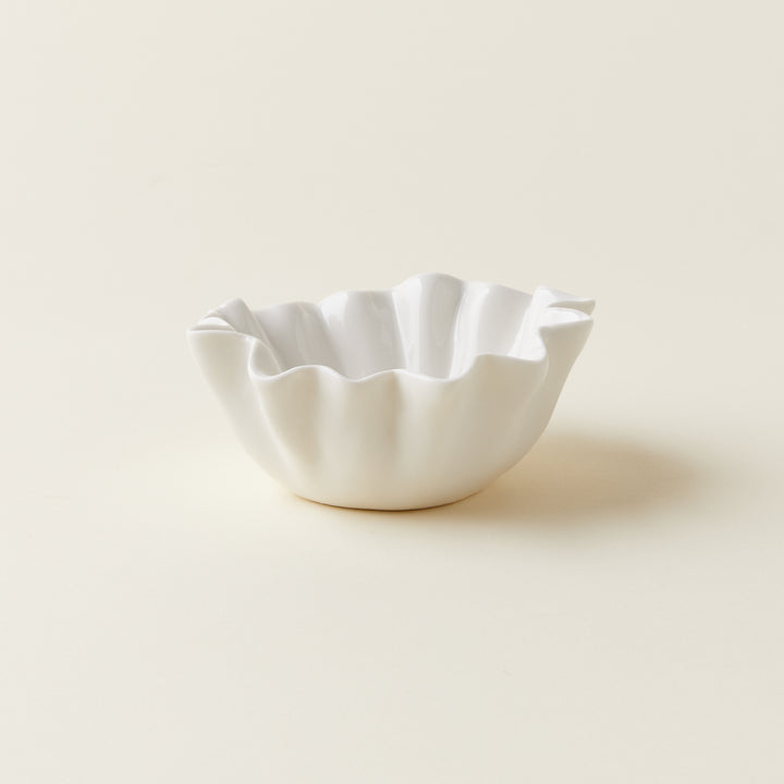 White stoneware fluted bowl with a unique texture.