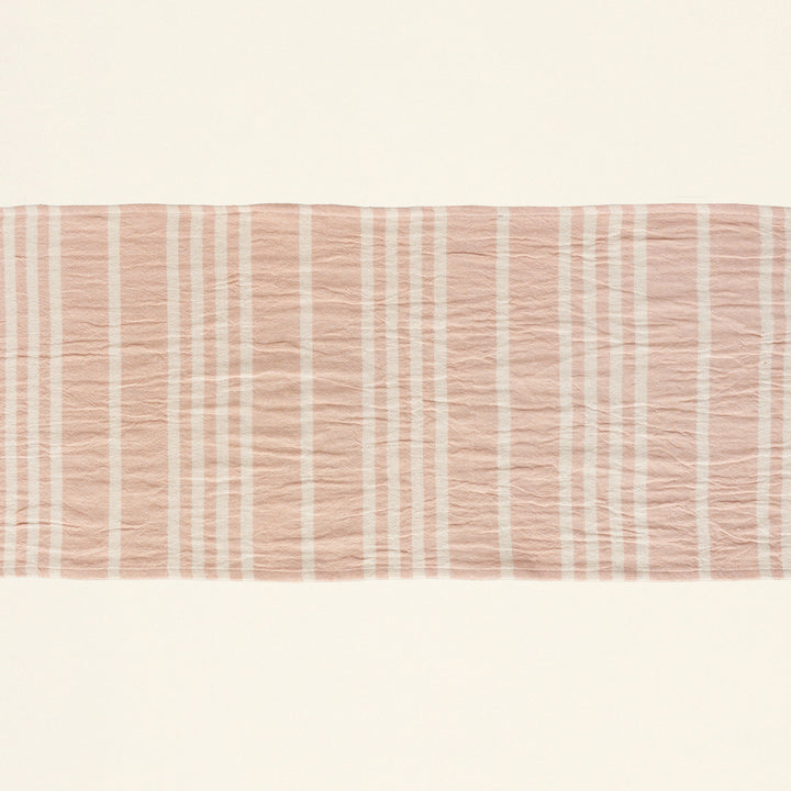 Tilly table runner with alternating pink and cream stripes.