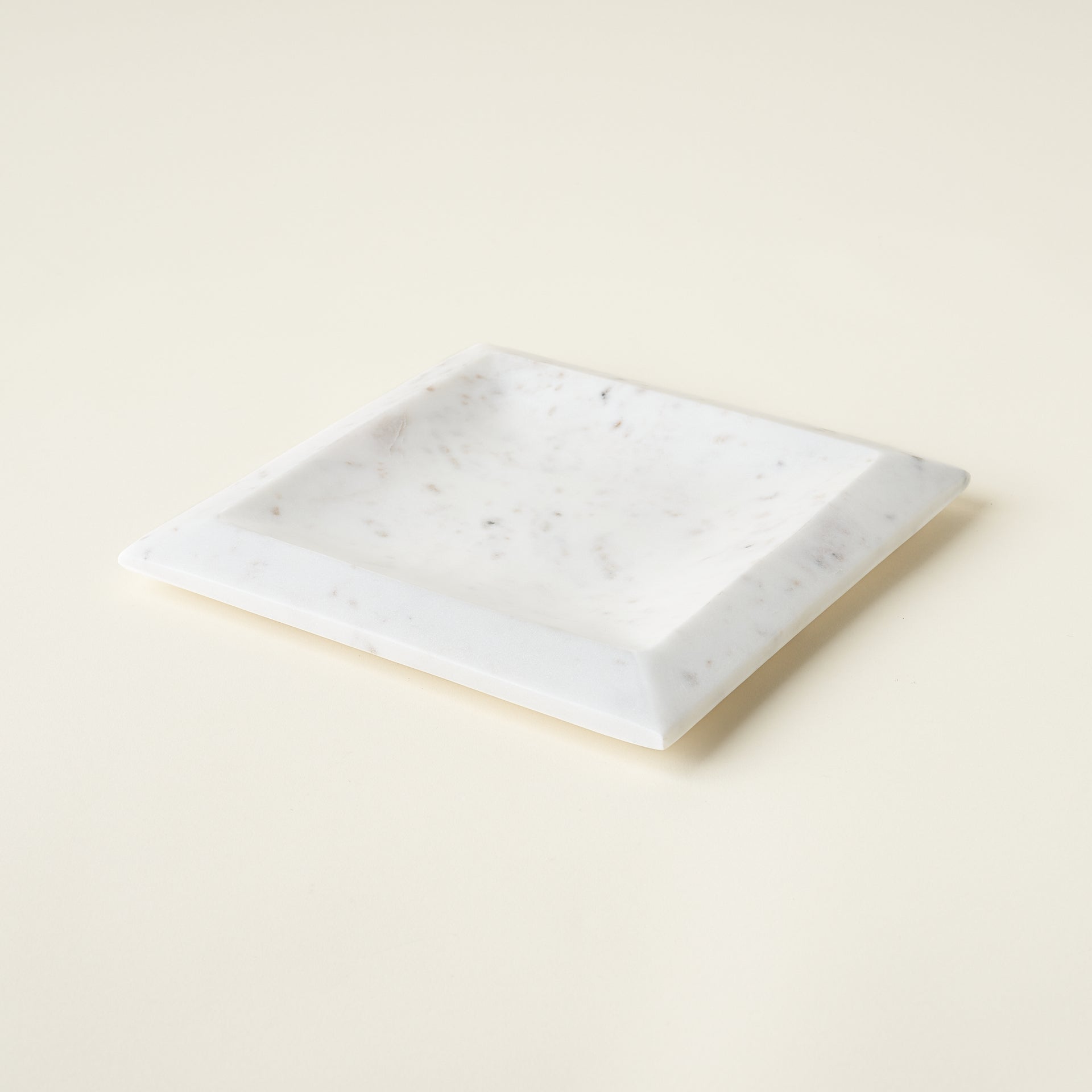 White marble pedestal with a sleek design.