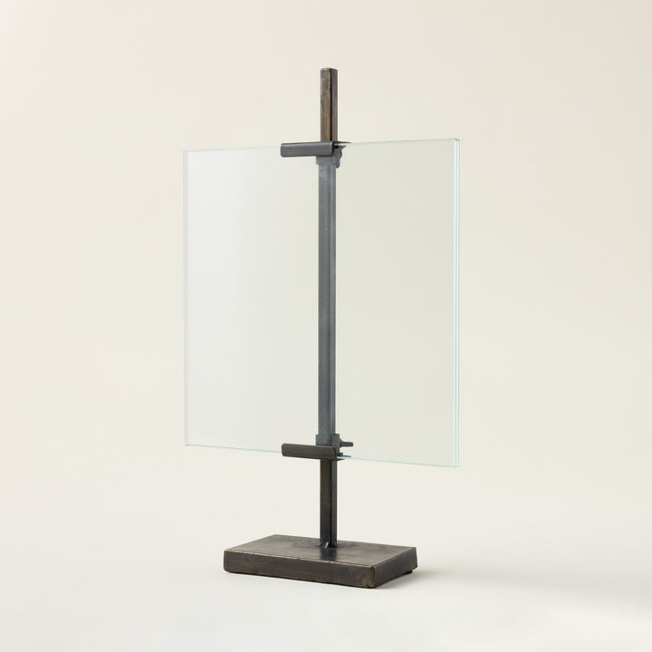 A floating photo frame with a black metal stand.