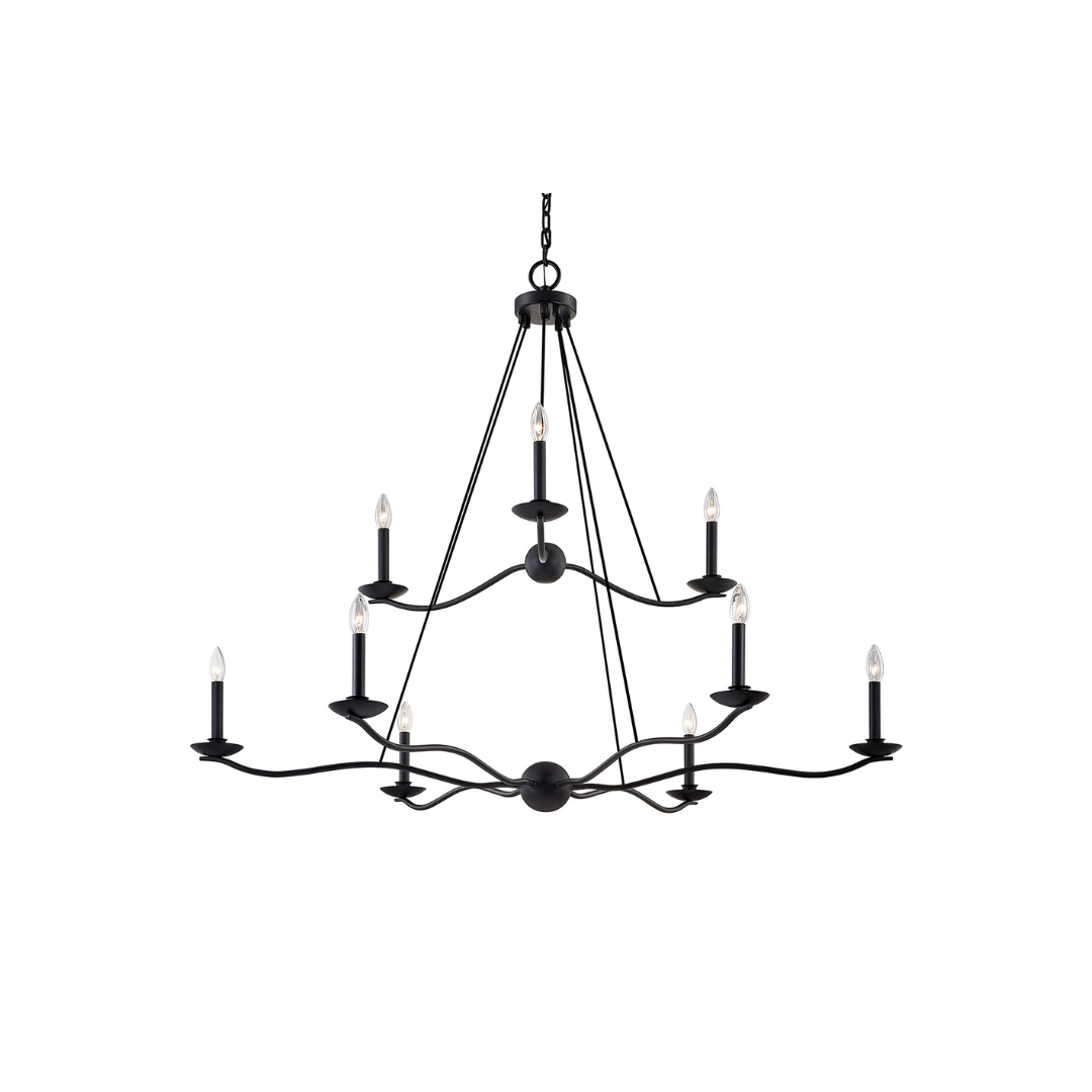 A chandelier with a forged iron finish and curved arms holding candlesticks.
