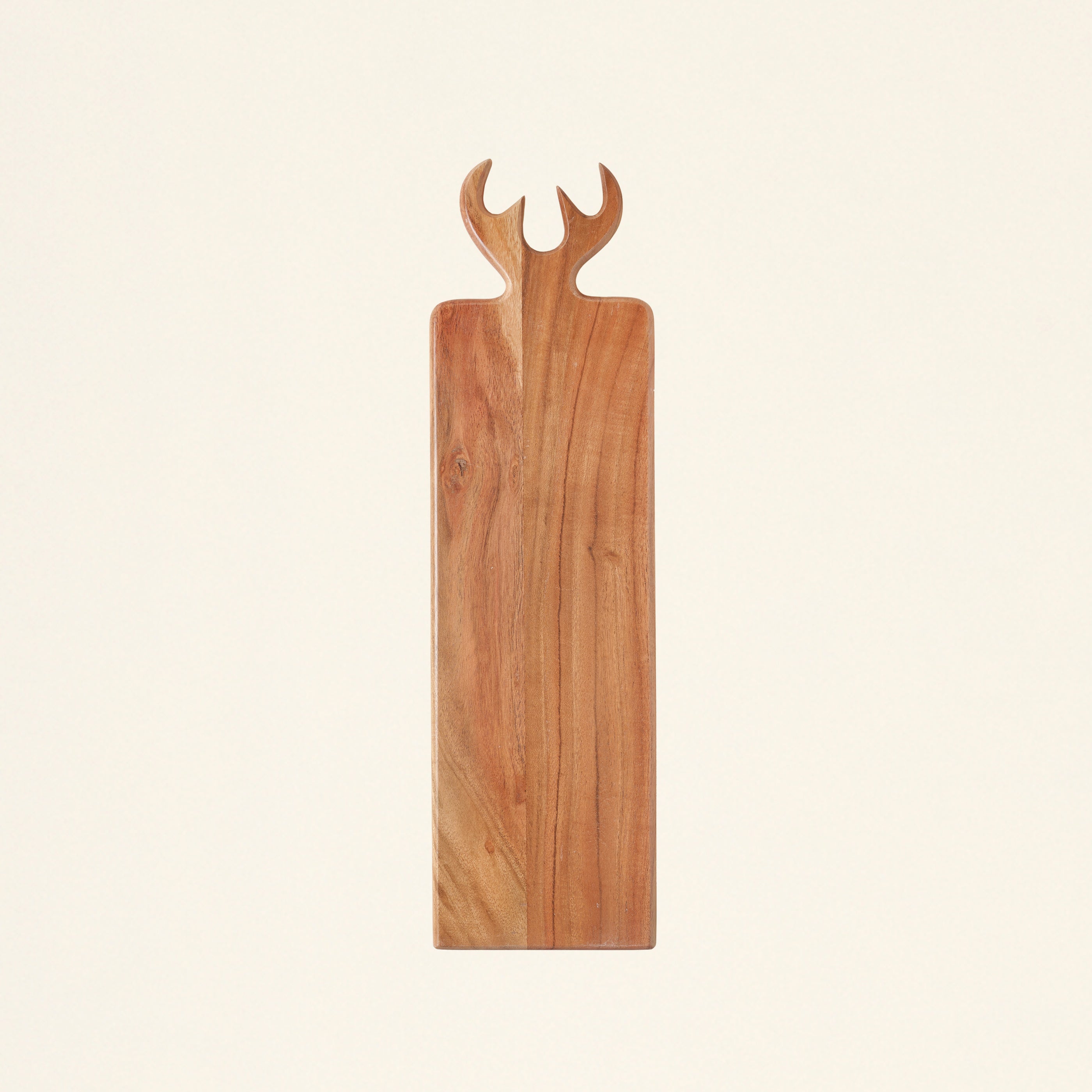 A serving board made of acacia wood with an antler-shaped handle.