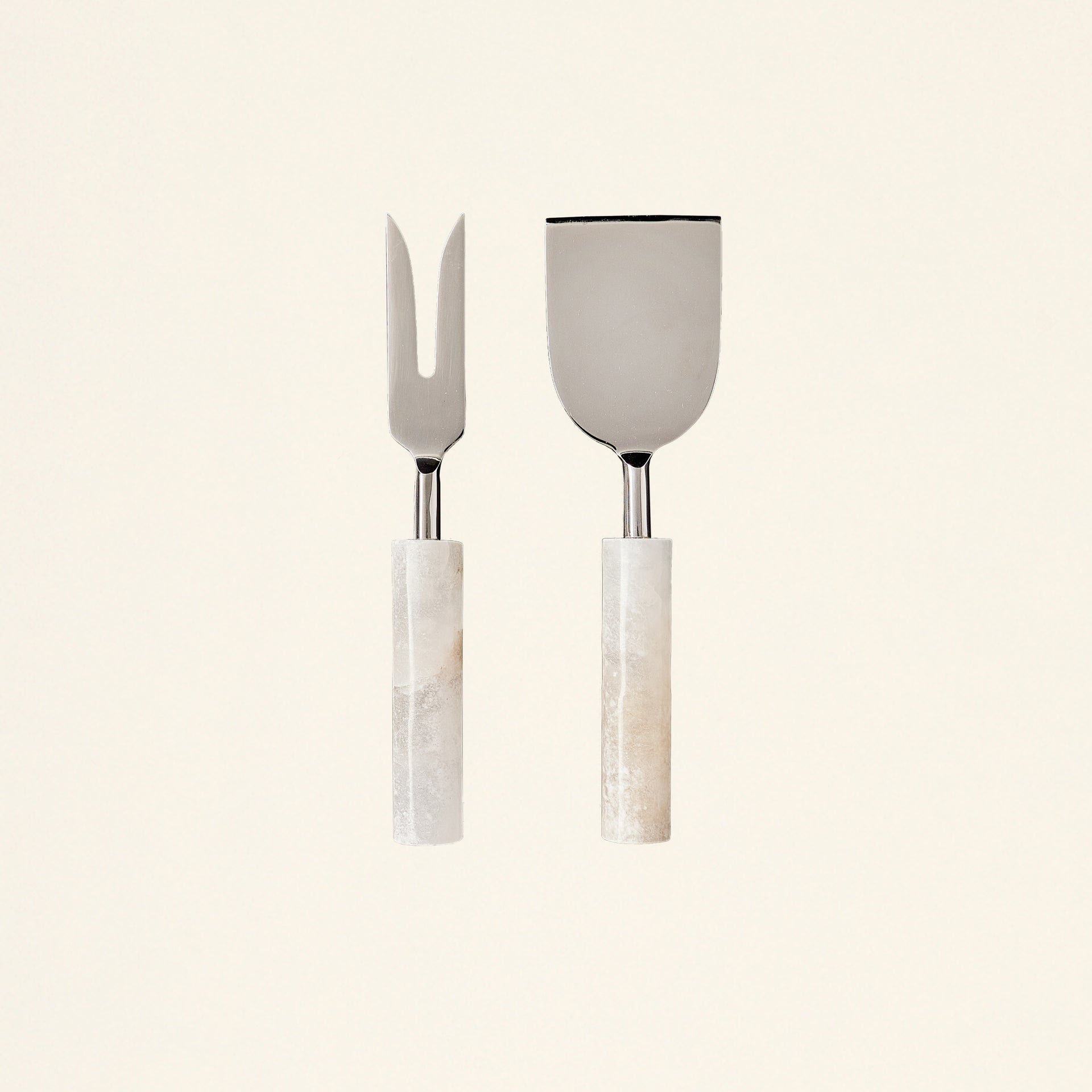 Set of two cheese tools with handles sculpted from Portuguese alabaster.