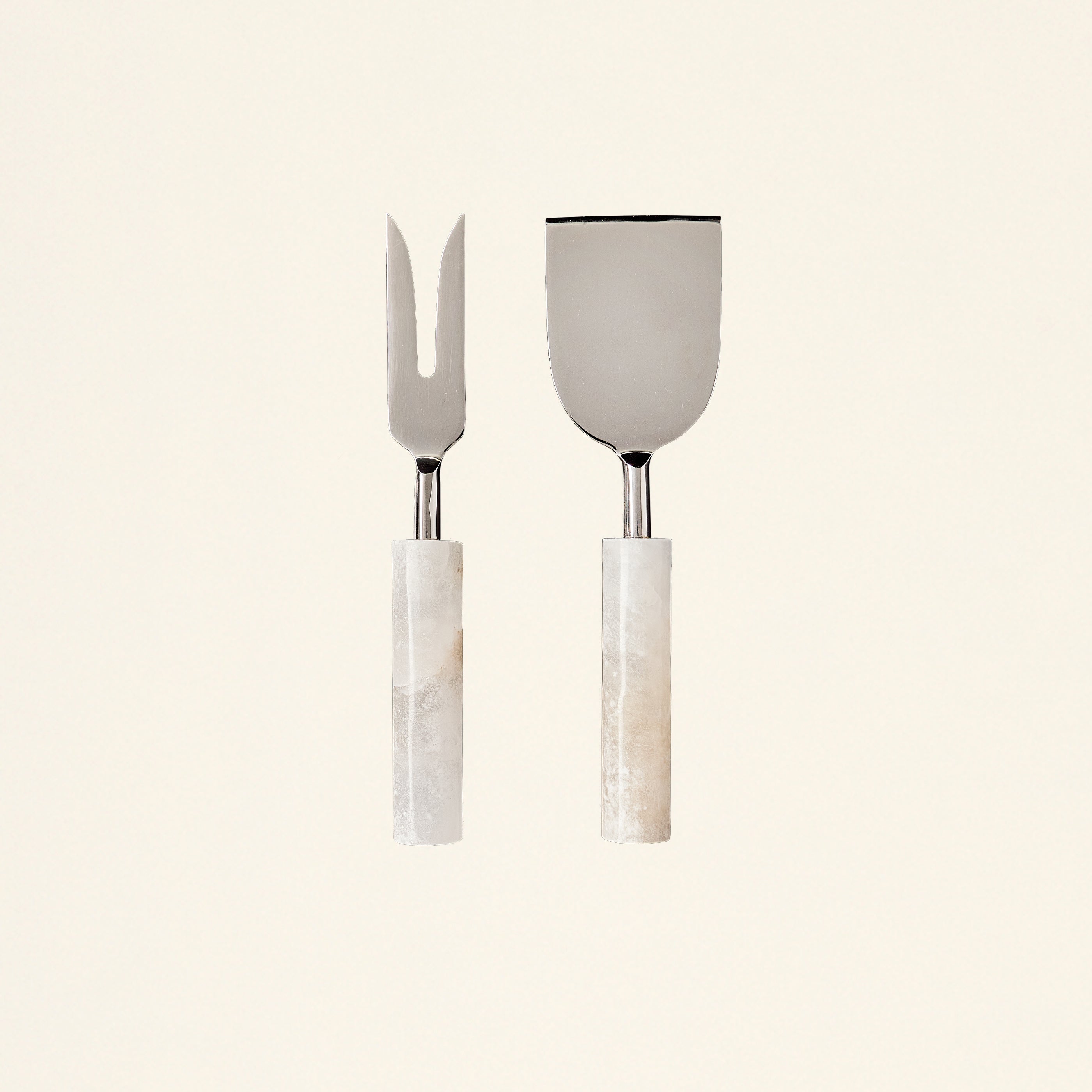 Set of two cheese tools with handles sculpted from Portuguese alabaster.